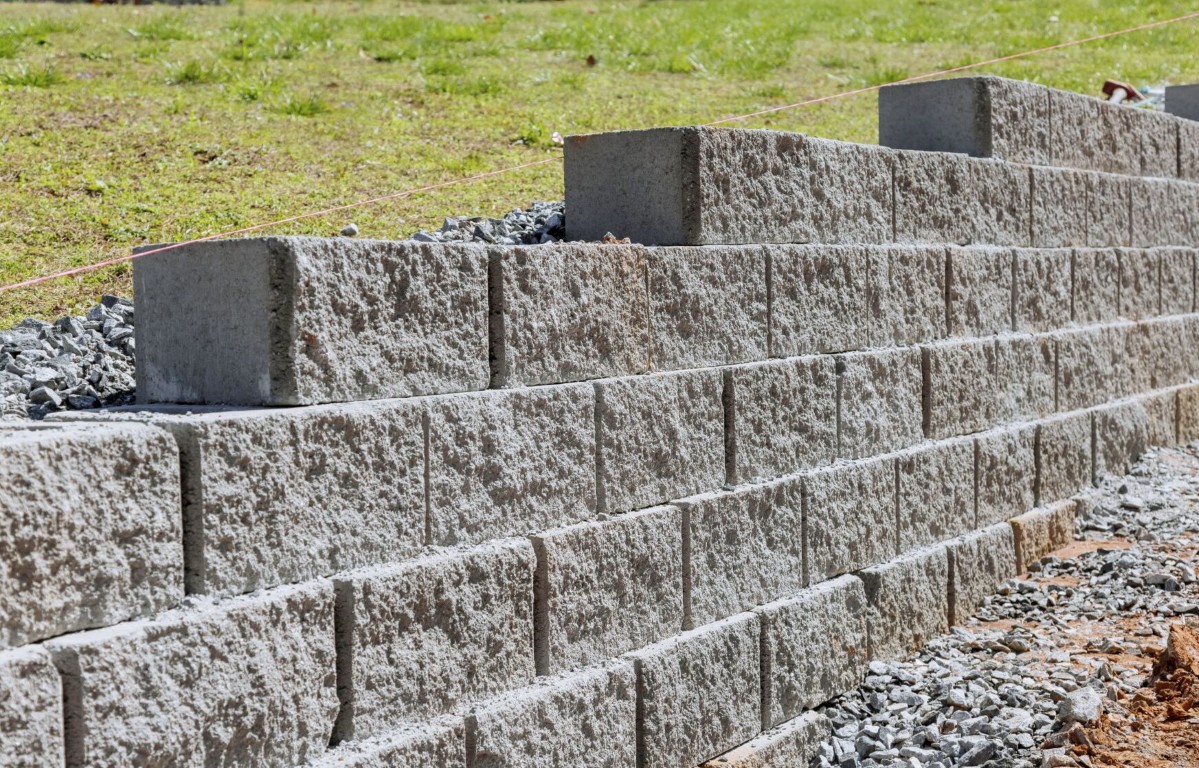 Retaining wall and concrete masonry construction